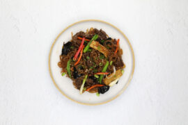 Japchae, made with sweet potato noodles, one of the delicious dishes on the menu at Arisun.