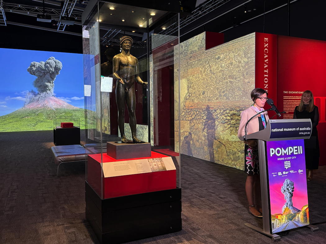 Dr Tiziana Rocco, of the Archaeological Park of Pompeii, speaking at the launch as curator Dr Lily Withycombe looks on. The statue of Apollo is from the dining room of the House of Julius Polybius.