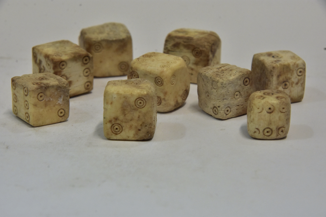 Dice made from bone from 1st century CE found in a wardrobe in the House of Julius Polybius.